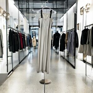 Elegant Cream Jumpsuit with Black Straps